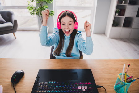Photo of cheerful glad crazy lovely girl winning online video computer game modern technology...
