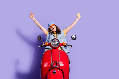 Photo of lovely pensioner lady ride motorcycle raise hands dressed stylish denim hipster garment...