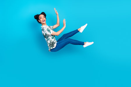 Full size photo of nice young girl fly wear shirt isolated on blue color background
