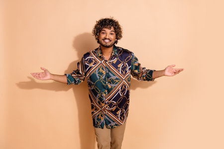 Photo portrait of handsome young male raise hands chatting smile dressed stylish print garment...
