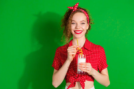 Photo portrait of lovely young lady drink straw milk glass dressed stylish red retro garment...