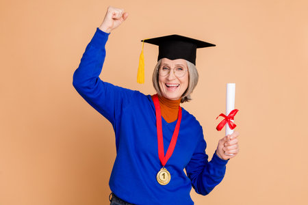 Photo portrait of attractive retired woman winning high education diploma dressed stylish blue...