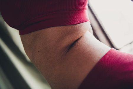 Cropped unretouched of girl with body curves wear red lingerie isolated studio backgroundの写真素材