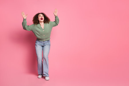 Photo of cheerful positive glad woman wear trendy khaki clothes look empty space isolated on pink color backgroundの写真素材
