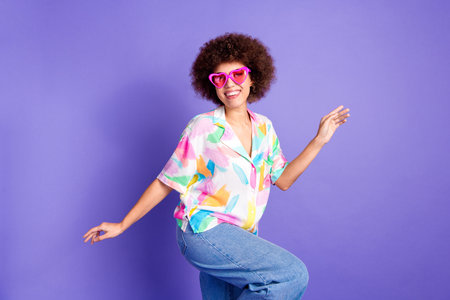 Photo portrait of pretty young girl sunglass dancing wear trendy colorful outfit isolated on purple...