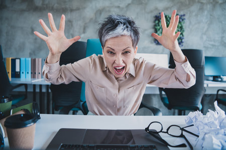 Photo of unhappy stressed mature lady specialist formalwear shouting you working modern gadget...
