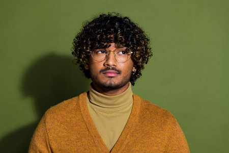 Photo portrait of pretty young male skeptical look empty space wear trendy brown outfit isolated on...