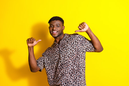 Photo of attractive cheerful man wear trendy clothes indicating himself isolated on yellow color...