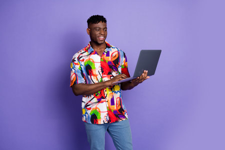 Photo portrait of handsome young guy hold netbook ecommerce dressed stylish colorful garment...