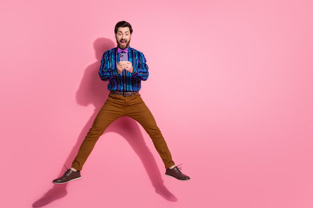 Photo of overjoyed glad nice elegant man wear stylish clothes empty space isolated on pink color...