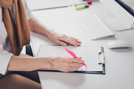Cropped photo of nice boss mature woman sign documents papers dressed formalwear comfortable light startup office loft room interiorの写真素材