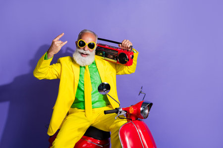 Photo of eccentric positive boyfriend wearing yellow stylish clothes listening music melody isolated...