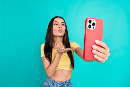 Portrait of nice young woman smart phone selfie kiss wear top isolated on turquoise color background
