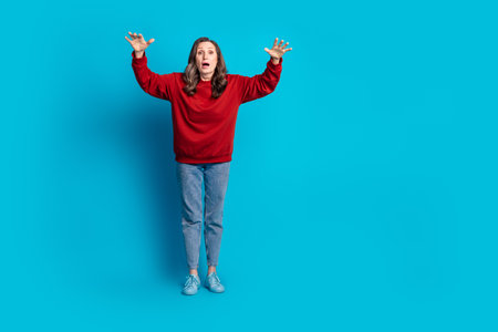 Full size photo of pretty aged lady empty space wear pullover isolated on blue color backgroundの写真素材