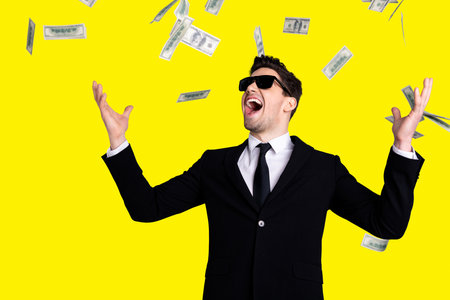 Portrait of his he nice elegant attractive cheerful guy sales manager financier banker economist director throwing away currency lottery credit win winner isolated over light gray backgroundの写真素材