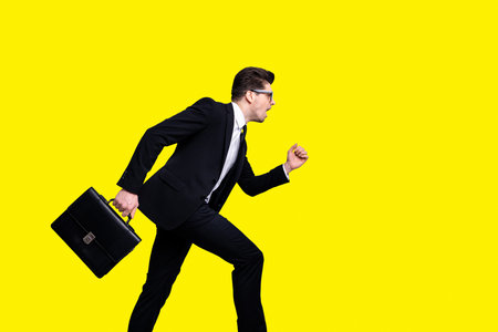 Profile side view portrait of his he nice elegant classy attractive worried guy carrying diplomat white collar rush hour late to workplace career growth isolated over light gray backgroundの写真素材