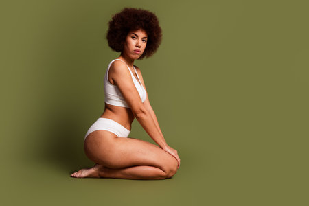 No retouch photo of dreamy seductive lady underwear lingerie accepting acne skin empty space isolated khaki color backgroundの写真素材