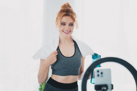 Photo of athletic active sportive charming lovely sporty woman hold towel gym physical exercises...