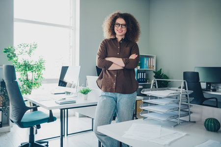 Photo of cheerful adorable charming successful woman administrator working in new office comfortable...