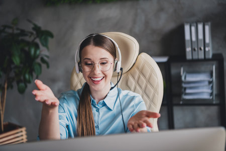 Photo of charming excited lady assistant wear shirt glasses earphones communicating modern gadget...