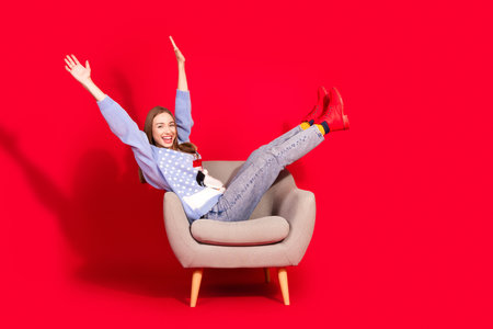 Photo of lovely nice woman wear stylish sweater preparing new year season shopping isolated on red color backgroundの写真素材