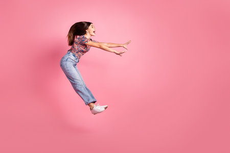 Full length photo of shiny attractive lady dressed retro outfit jumping high empty space isolated...