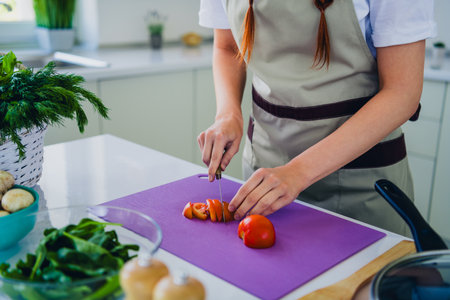 Close up photo of woman cooking meal tasty dish table kitchen home house day light indoorsの写真素材