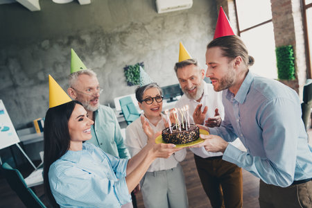 Portrait of group professional office workers congratulate colleague birthday cake loft interior...