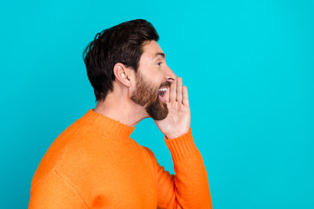Profile side photo of attractive cheerful nice man wear orange trendy clothes look empty space...