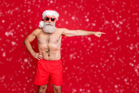 Portrait of nice attractive handsome content sporty virile strict bossy bearded gray-haired man sending you away way solution decision sea season isolated over bright vivid shine red backgroundの写真素材