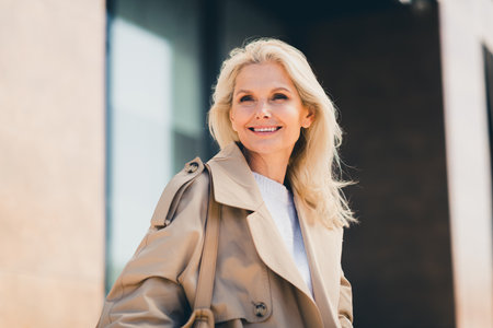 Photo of pretty cute dreamy woman dressed stylish clothes walking city center autumn weather dayの写真素材
