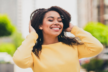 Photo of dreamy lovely girl wear yellow stylish clothes touch hair autumn september day outdoors