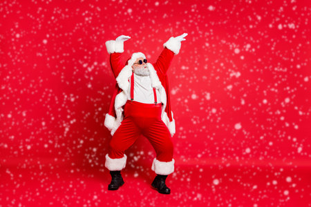 Feeling young and fresh concept. Full length photo of comic humorous joking carefree careless enjoying bass sound music moving hands in air wearing coat isolated vivid backgroundの写真素材