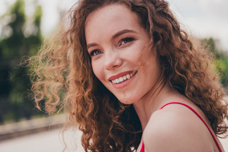 Photo of pretty sweet woman cheerful smile model dressed red shirt outdoors urban modern townの写真素材