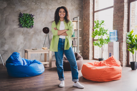 Full size photo of nice young woman office worker crossed arms loft interior business center indoorsの写真素材