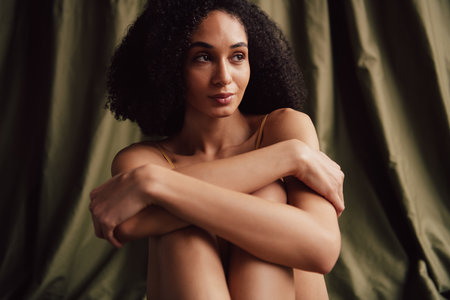 No retouch photo of prety lovely girl wear love herself hug cuddle isolated on textile khaki color backgroundの写真素材