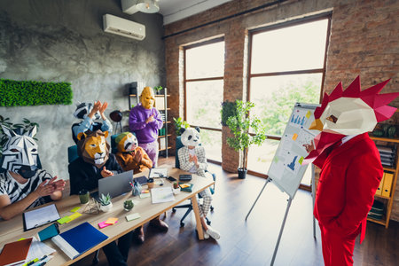 Photo of panda gorilla lion sloth zebra raccoon mask business people clapping rooster boss presentation loft interior office indoorsの写真素材