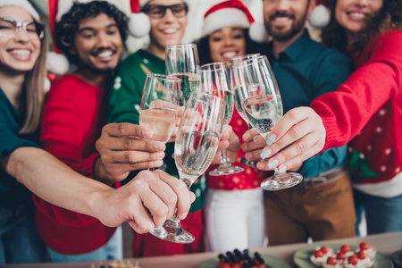 Photo of young funny cheerful people friends wear new year clothes drink wine celebrate corporate party indoors officeの写真素材