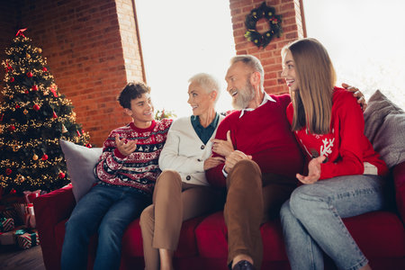 Portrait of big friendly family sit sofa cuddle communicate xmas new year celebration flat indoors