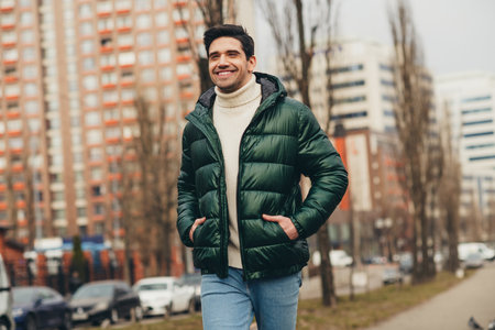 Photo of nice handsome man wearing trendy clothes going urban park street cold autumn day outdoorsの写真素材