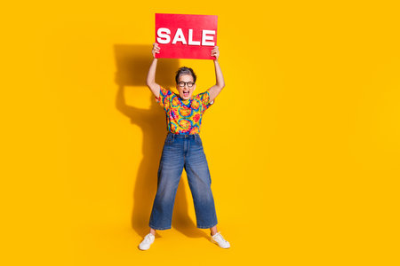 Full size photo of nice aged lady shout hold sale blank wear t-shirt isolated on yellow color...