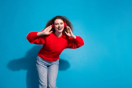 Photo portrait of attractive young woman earphones listen music have fun dressed stylish red clothes...