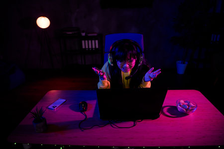 Photo of cute lovely nice girl amazed reaction play gamer computer laptop modern technology indoors...