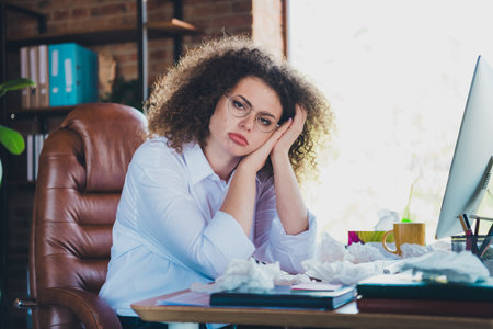 Photo of pretty curly young girl sick coronavirus tired wear formalwear business adviser coworking successful nice light officeの写真素材