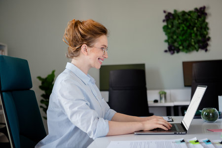 Photo of lovely young lady typing netbook dressed formalwear business manager comfortable startup...