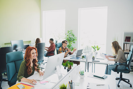 Photo of group young corporate workers desktop computer workstation office business center indoors
