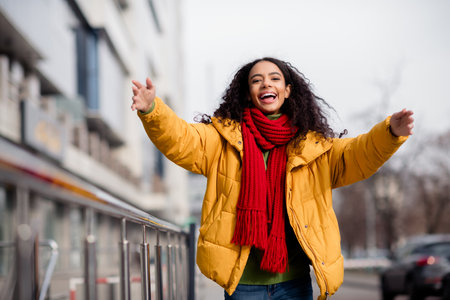 Photo of charming cheerful girl wear trendy coat walk downtown city center weekend trip autumn day...