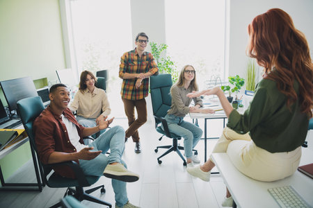 Photo of cheerful friendly young it coworkers chatting enjoying professional education together...