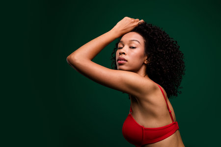 Photo of gorgeous stunning lady touching posing for photography look wear red undercloth isolated green color backgroundの写真素材