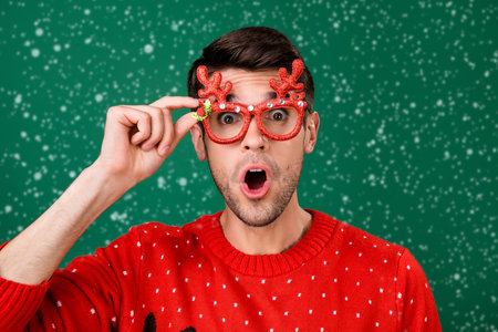 Photo portrait man wearing funny glasses stare amazed shocked excited isolated green color...